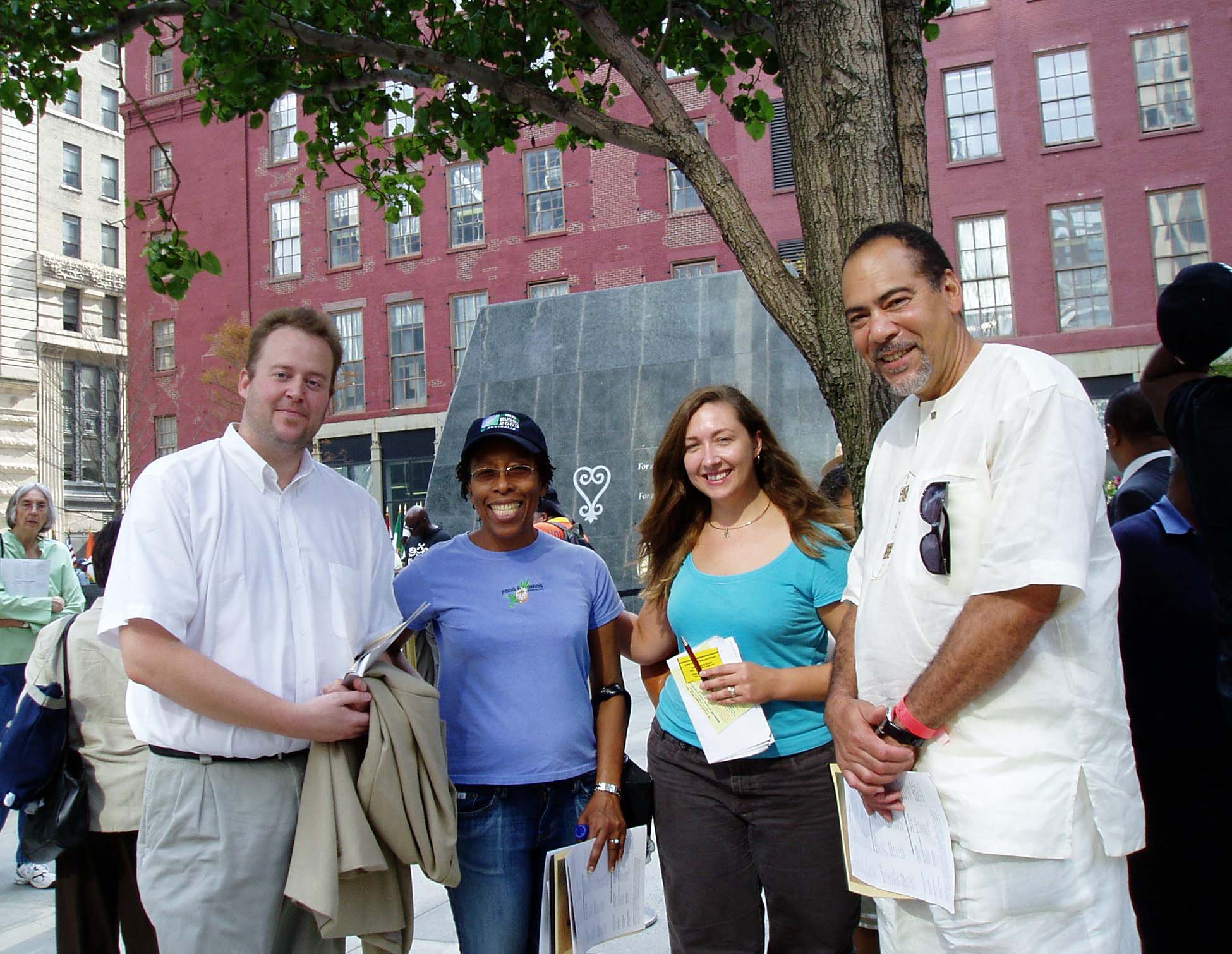 Graduate Research Associate Christopher Crain, Research Associate Grace Turner (PhD '12), and Associate Director Autumn Barrett (PhD '13) with Director Michael Blakey at the opening of the African Burial Ground National Monument (in background) in New York City in 2007
